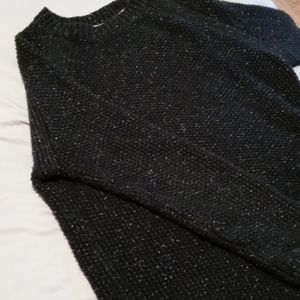 Thick woven wool or cotton sweater.
